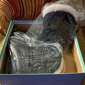 Black low cut cowboy style boots.